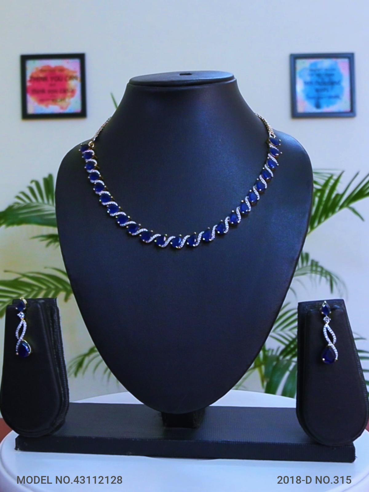 Dark Blue Doublet Stone and white CZ Stones in Gold Finish