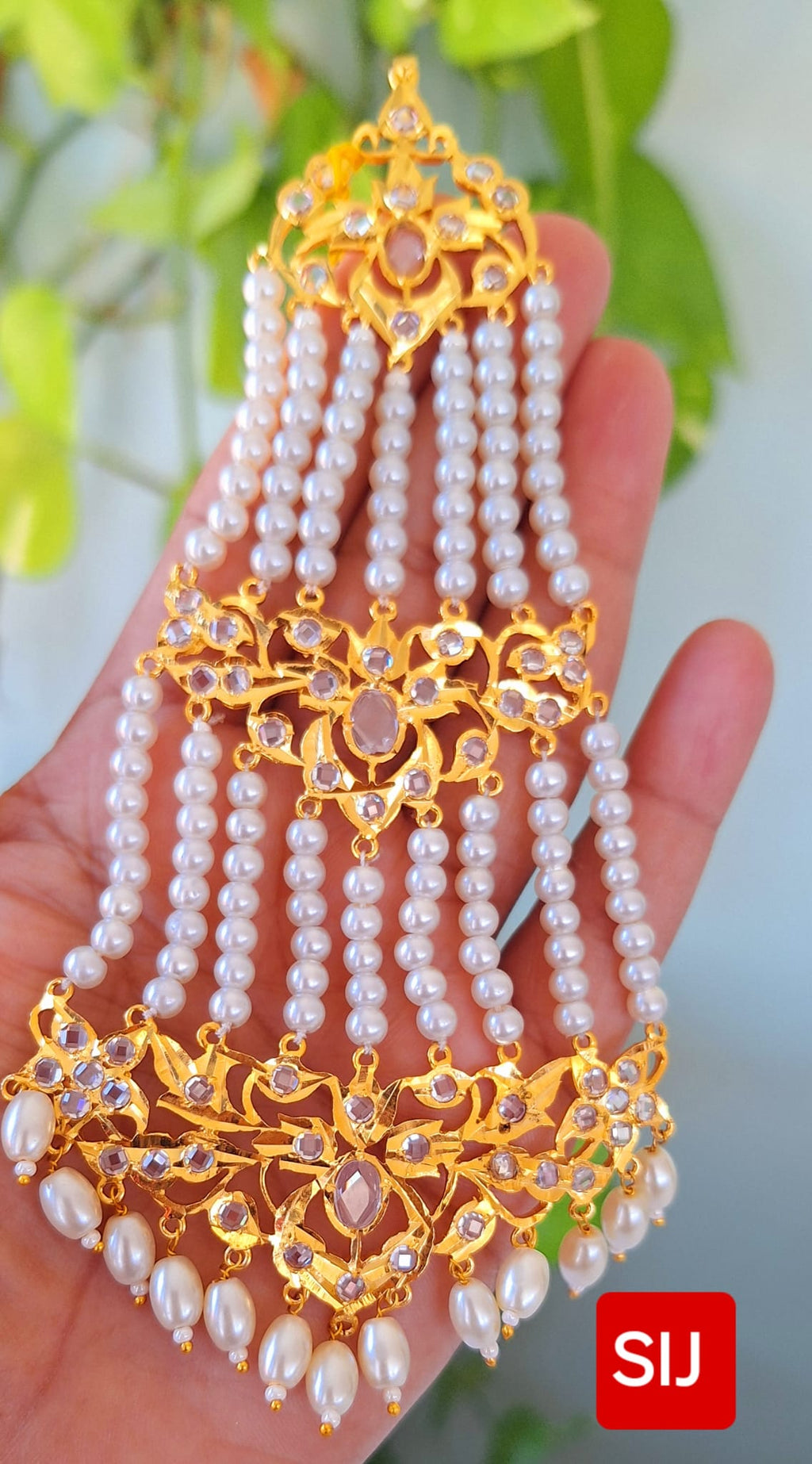 Nizaami Polki Jhumar/Pasa in shell Pearl’s Gold Plated