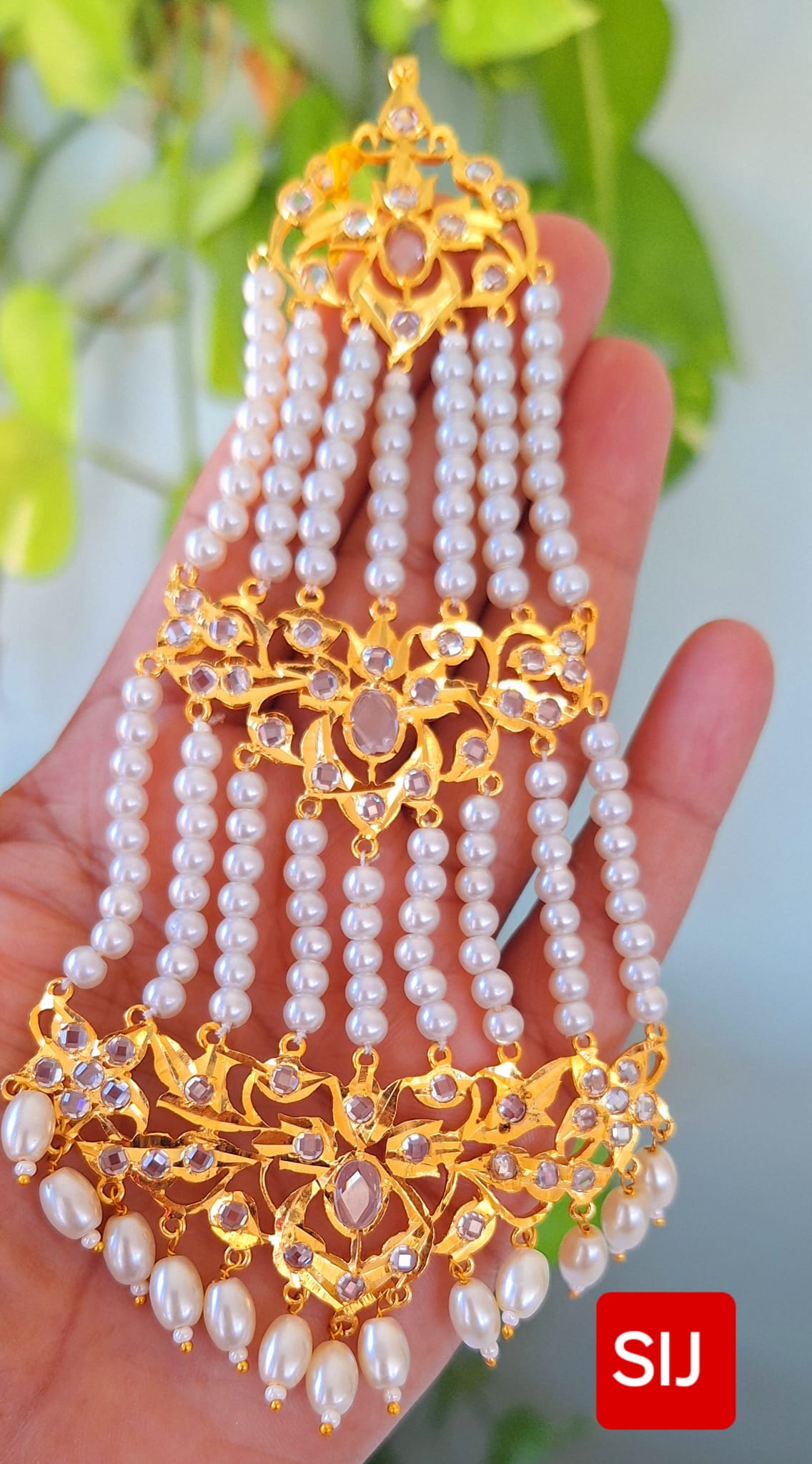 Nizaami Polki Jhumar/Pasa in shell Pearl’s Gold Plated